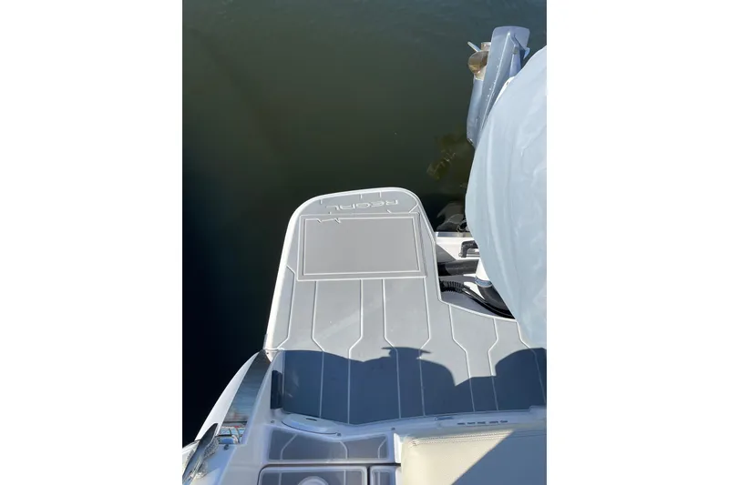 Slide: The Image of 2020 Regal 26 OBX boat stern view with outboard motor and swim platform. - 34