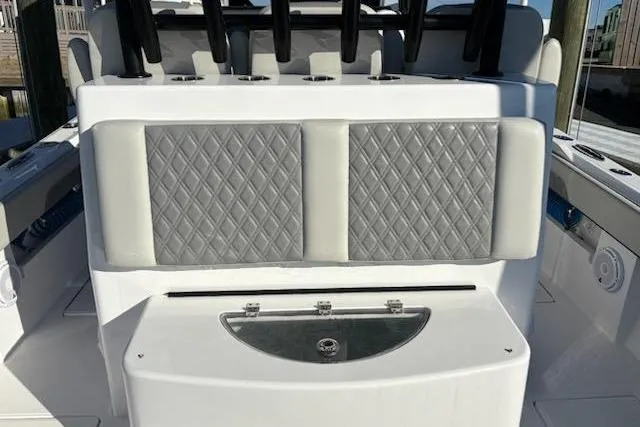 Slide: The Image of 2025 Front Runner 36 Center Console with diamond-stitched seating and sleek design. - 10