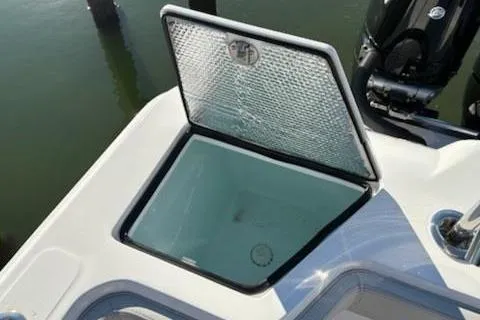 Slide: The Image of 2025 Front Runner 36 Center Console boat with open storage compartment. - 12