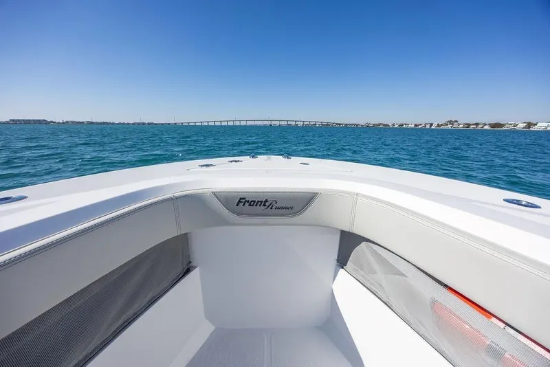 Slide: The Image of 2025 Front Runner 36 Center Console boat on open water, clear sky, distant bridge. - 18