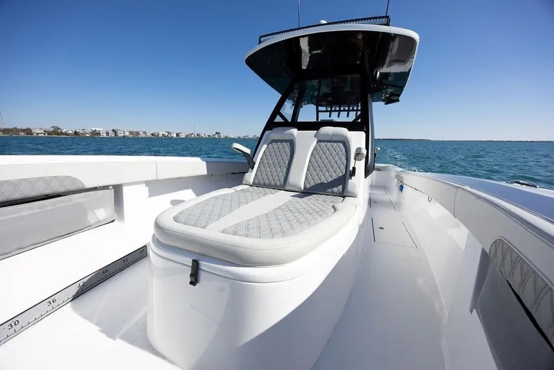 Slide: The Image of 2025 Front Runner 36 Center Console boat on open water, featuring sleek seating and modern design. - 19