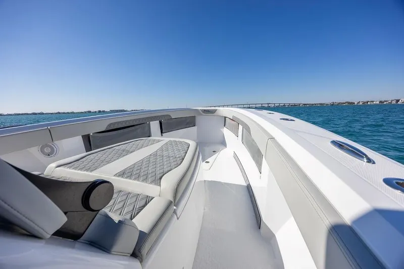 Slide: The Image of 2025 Front Runner 36 Center Console boat interior with luxurious seating on open water. - 21