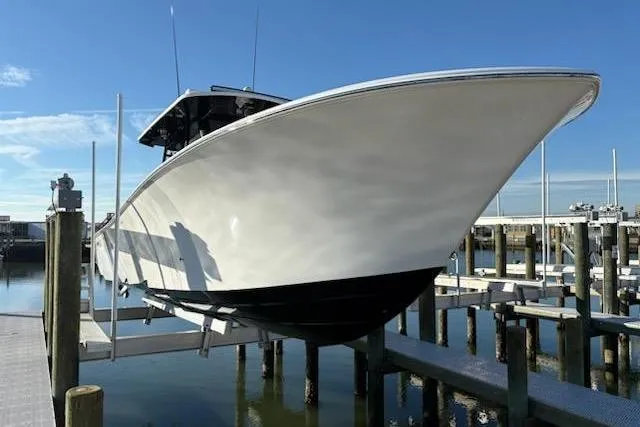 Slide: The Image of 2025 Front Runner 36 Center Console boat docked at marina, clear blue sky. - 3