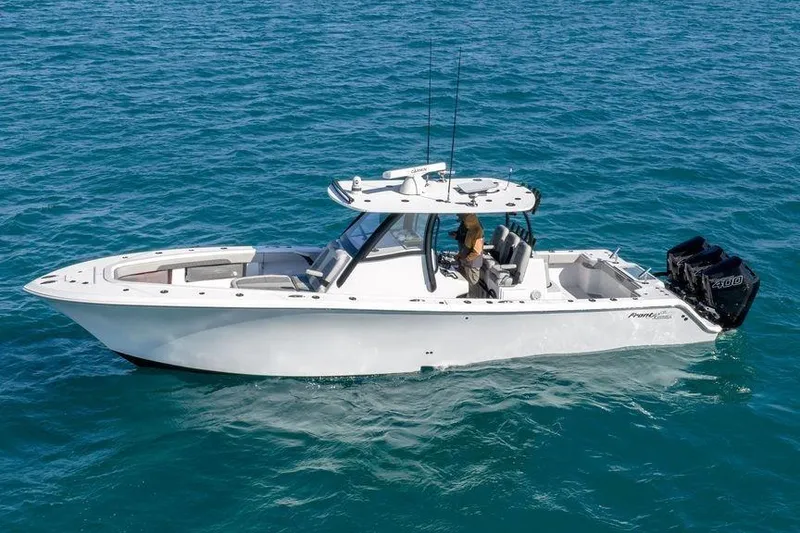 Slide: The Image of 2025 Front Runner 36 Center Console boat cruising on clear blue water. - 4