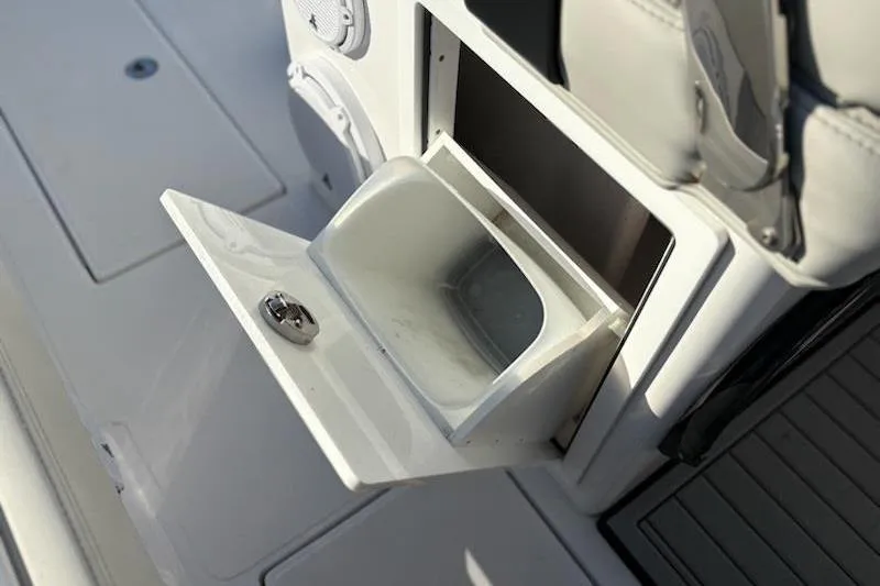 Slide: The Image of Open storage compartment on 2025 Front Runner 36 Center Console boat. - 9