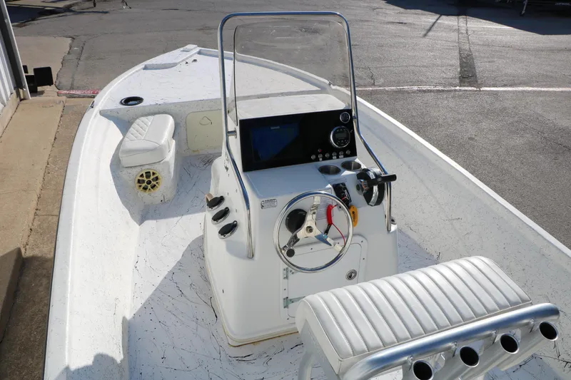 Slide: The Image of 2007 Mako 191 Inshore boat interior with steering console and seating. - 14
