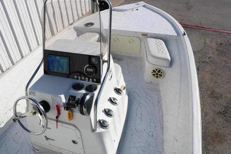 Slide: The Image of 2007 Mako 191 Inshore boat interior with steering console and seating. - 16