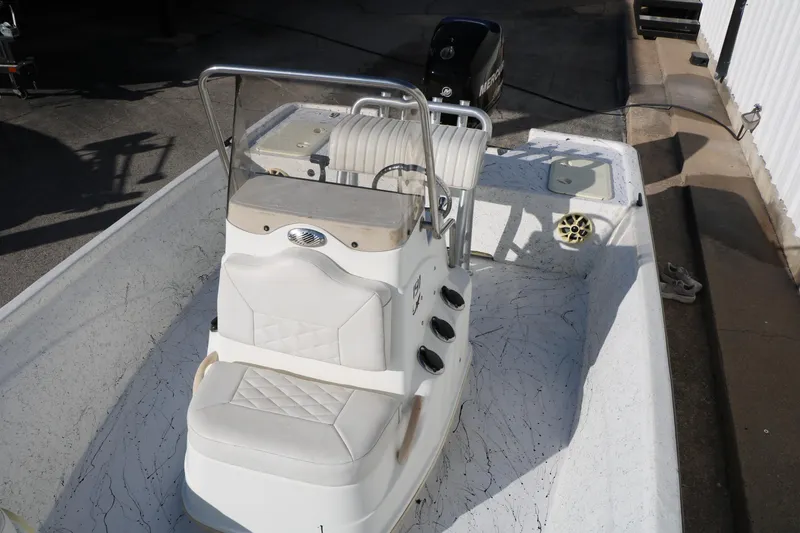 Slide: The Image of 2007 Mako 191 Inshore boat interior with seating and steering console. - 19