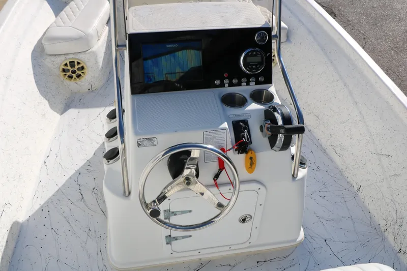 Slide: The Image of 2007 Mako 191 Inshore boat console with steering wheel and control panel. - 23