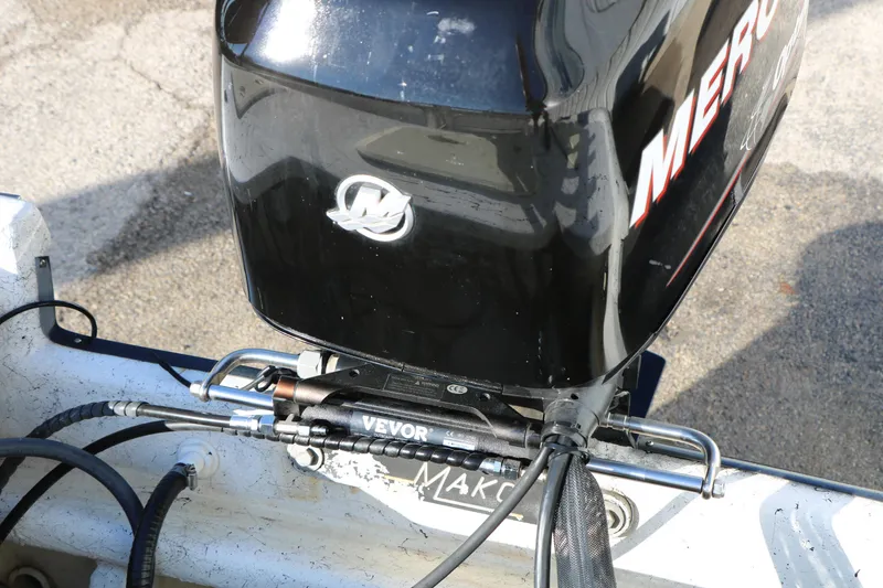 Slide: The Image of 2007 Mako 191 Inshore boat with a Mercury outboard motor and Vevor hydraulic steering. - 26