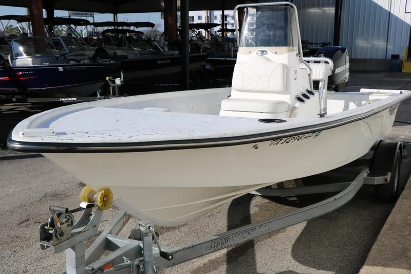Slide: The Image of 2007 Mako 191 Inshore boat on trailer, parked in a marina. - 6