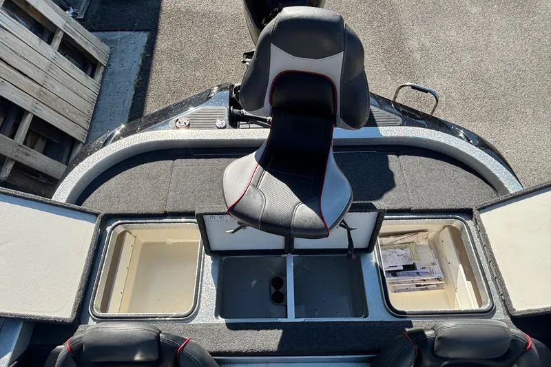 Slide: The Image of 2018 Ranger Z519 Comanche boat interior with storage compartments and seating. - 11