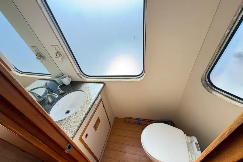 Slide: The Image of 1988 Cheoy Lee 66 Long Range MY yacht bathroom with sink and toilet. - 10