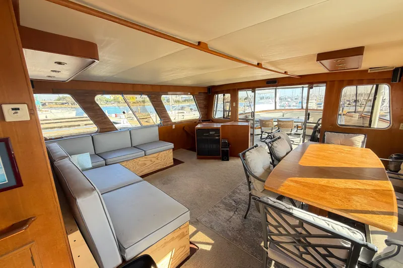 Slide: The Image of Interior of 1988 Cheoy Lee 66 Long Range MY yacht with spacious seating and dining area. - 12