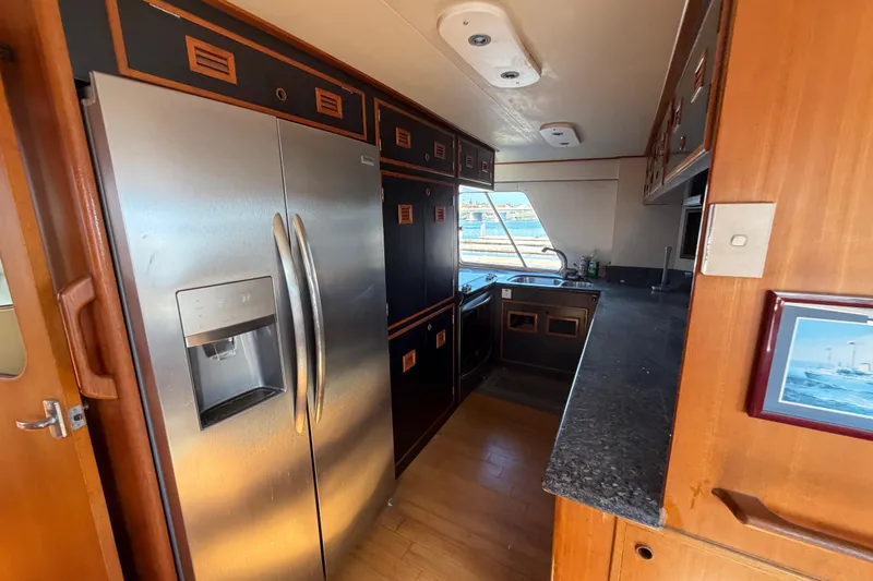 Slide: The Image of Galley kitchen in 1988 Cheoy Lee 66 Long Range MY yacht with stainless steel fridge. - 13