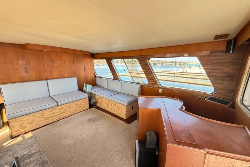 Slide: The Image of Interior of 1988 Cheoy Lee 66 Long Range MY yacht with wood paneling and seating. - 15