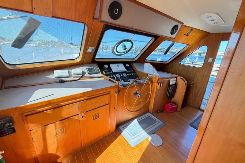 Slide: The Image of 1988 Cheoy Lee 66 Long Range MY helm with wooden interior and panoramic windows. - 16