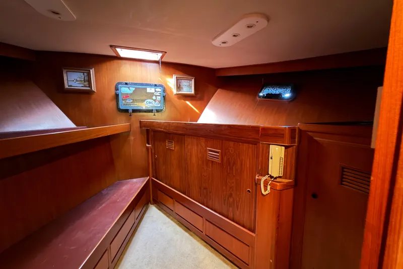 Slide: The Image of Interior of 1988 Cheoy Lee 66 Long Range MY yacht with wood paneling and vintage decor. - 25