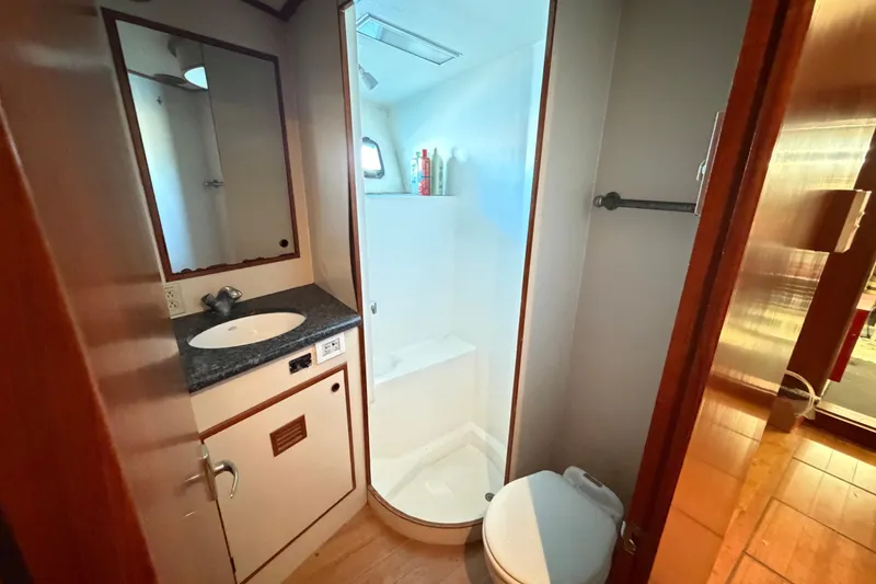 Slide: The Image of Bathroom interior of 1988 Cheoy Lee 66 Long Range MY yacht, featuring sink and shower. - 26