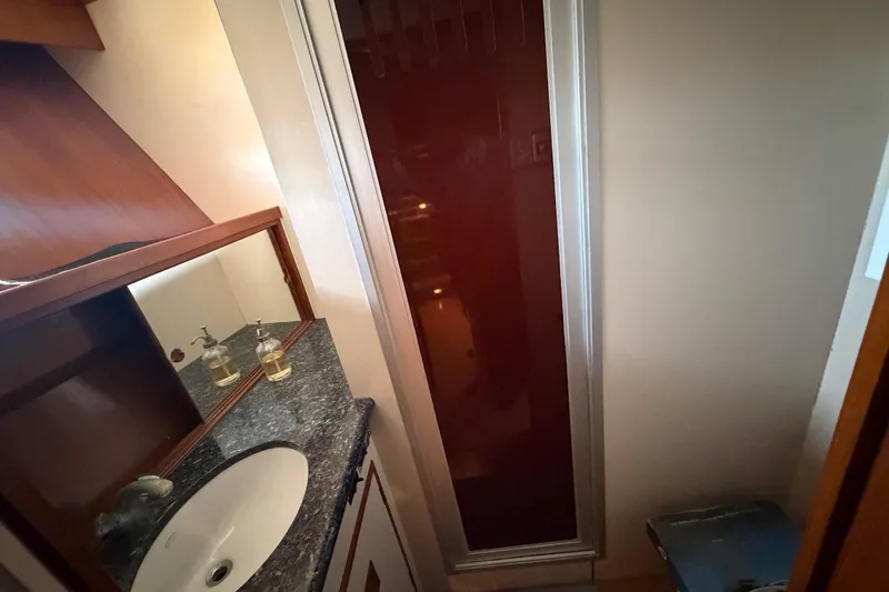 Slide: The Image of Bathroom interior of 1988 Cheoy Lee 66 Long Range MY yacht, featuring sink and shower. - 29