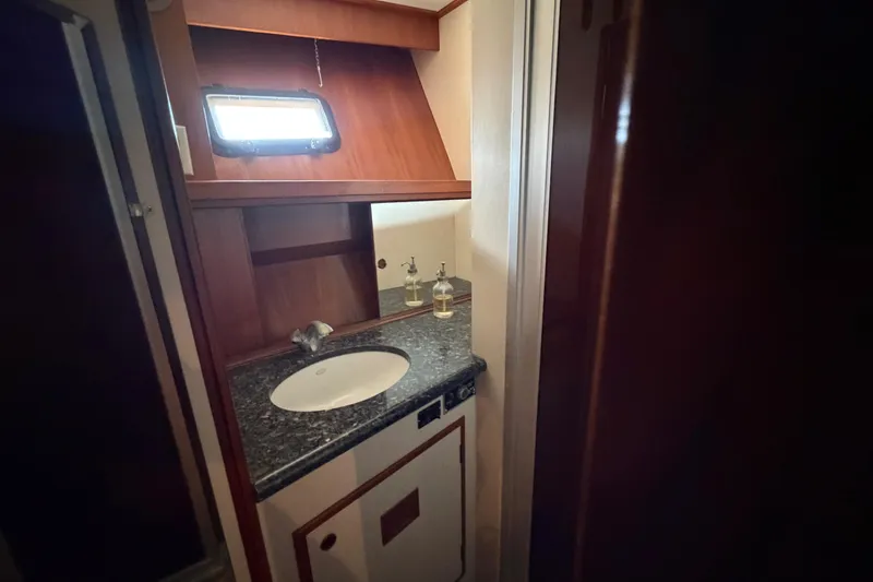 Slide: The Image of 1988 Cheoy Lee 66 Long Range MY yacht bathroom with sink and window. - 30