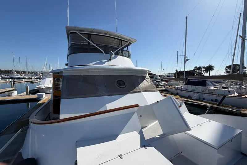 Slide: The Image of 1988 Cheoy Lee 66 Long Range MY yacht docked at marina under clear blue sky. - 32