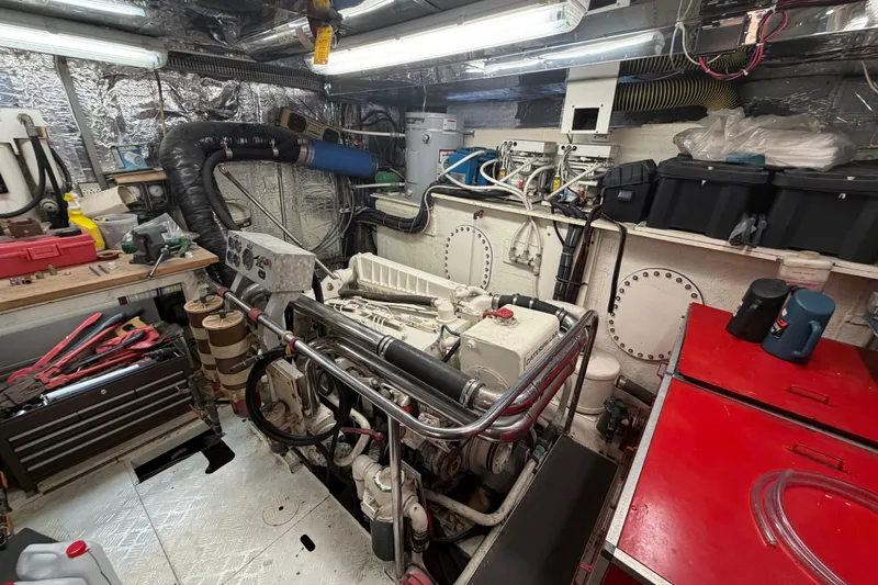 Slide: The Image of Engine room of 1988 Cheoy Lee 66 Long Range MY yacht, featuring tools and equipment. - 33