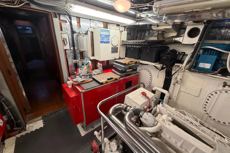 Slide: The Image of Engine room of 1988 Cheoy Lee 66 Long Range MY yacht, featuring tools and equipment. - 35