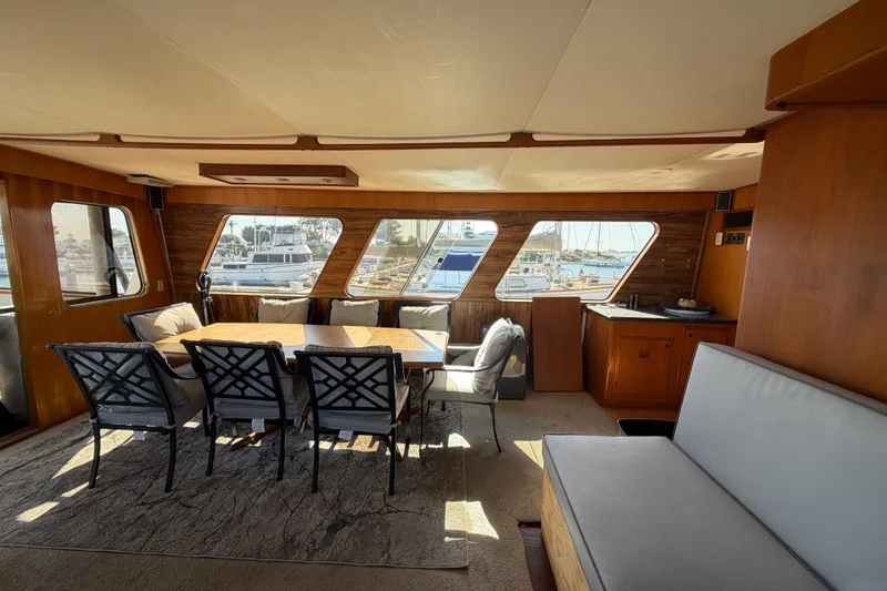 Slide: The Image of Interior of 1988 Cheoy Lee 66 Long Range MY yacht with dining area and large windows. - 39