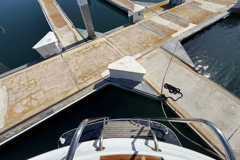 Slide: The Image of 1988 Cheoy Lee 66 Long Range MY docked at marina, view from bow. - 42