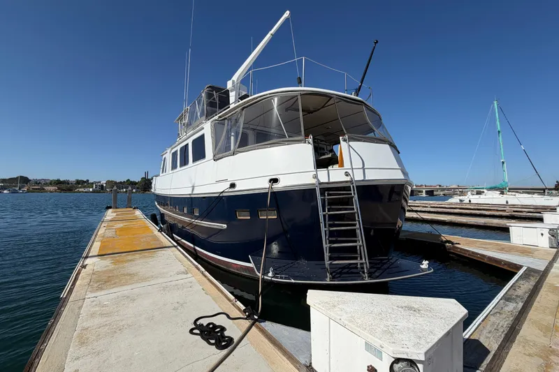 Slide: The Image of 1988 Cheoy Lee 66 Long Range MY yacht docked at marina under clear blue sky. - 43