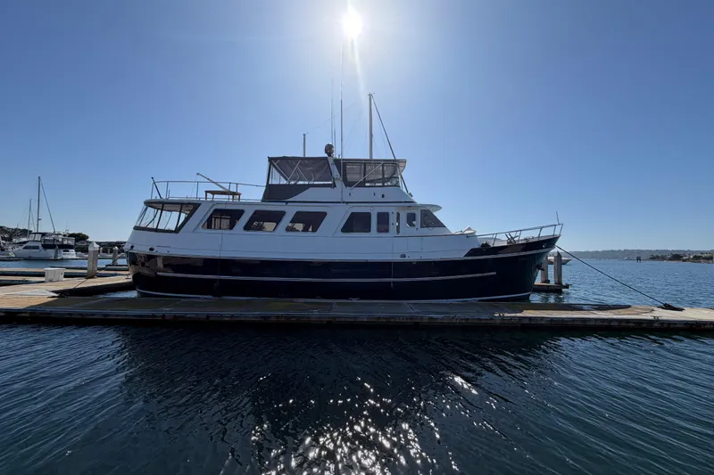 Slide: The Image of 1988 Cheoy Lee 66 Long Range MY yacht docked under clear blue sky. - 5