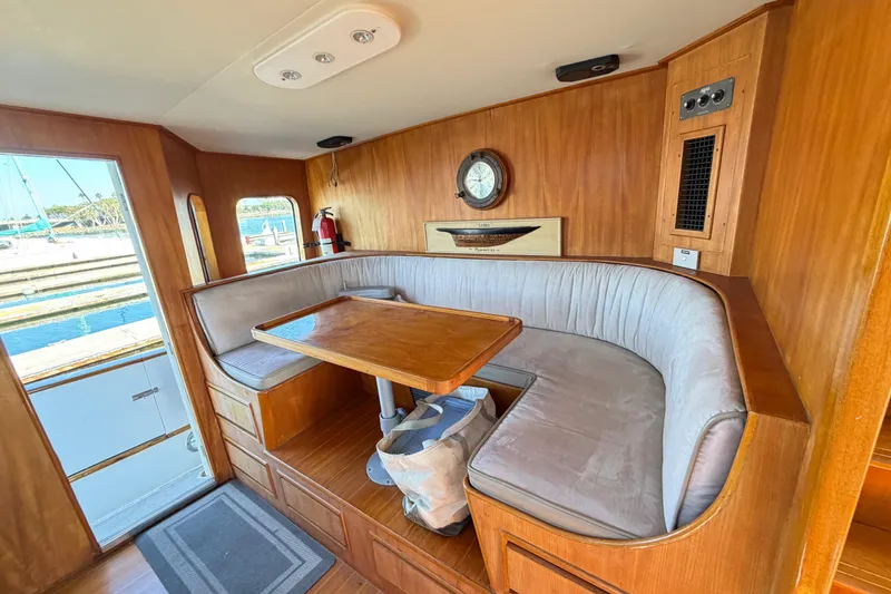 Slide: The Image of Interior of 1988 Cheoy Lee 66 Long Range MY yacht with wooden dining area. - 6