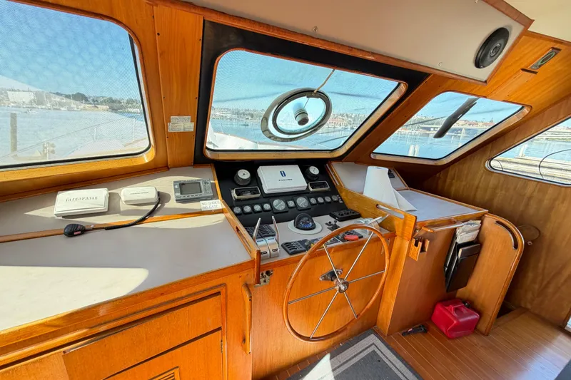 Slide: The Image of Helm of 1988 Cheoy Lee 66 Long Range MY with wooden steering wheel and navigation instruments. - 7