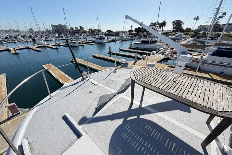 Slide: The Image of 1988 Cheoy Lee 66 Long Range MY yacht docked in a sunny marina. - 8