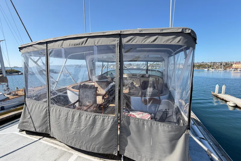 Slide: The Image of 1988 Cheoy Lee 66 Long Range MY yacht with enclosed cockpit, docked in a marina. - 9