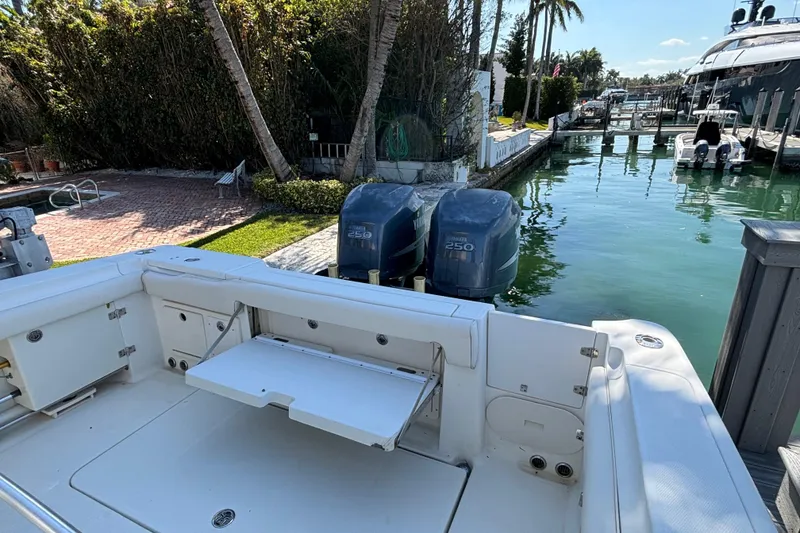 Slide: The Image of 2006 Hydra-Sports Vector 3300 CC boat docked, featuring twin Yamaha 250 engines. - 16