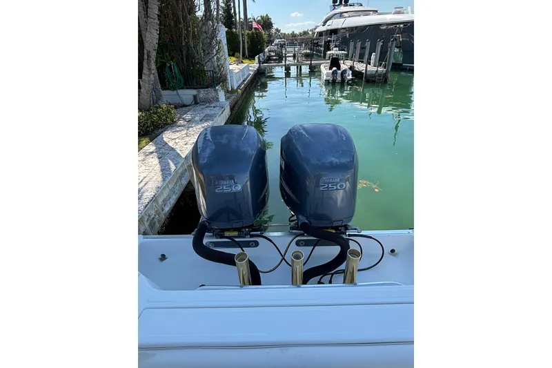 Slide: The Image of 2006 Hydra-Sports Vector 3300 CC with twin Yamaha 250 engines docked by the water. - 18