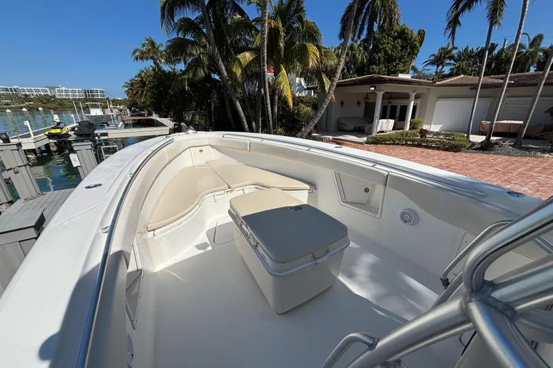 Slide: The Image of 2006 Hydra-Sports Vector 3300 CC boat docked near waterfront home with palm trees. - 9