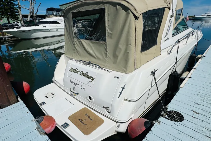 Slide: The Image of 2000 Sea Ray 290 Sundancer docked, featuring beige canopy and "Isleton, CA" text. - 12