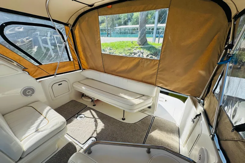 Slide: The Image of Interior view of 2000 Sea Ray 290 Sundancer boat with seating and canopy. - 18