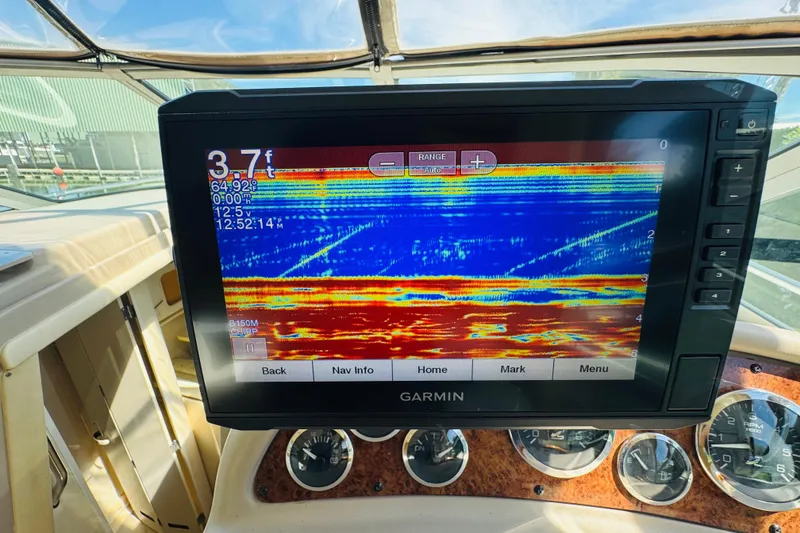 Slide: The Image of Garmin fishfinder display on 2000 Sea Ray 290 Sundancer boat dashboard. - 23