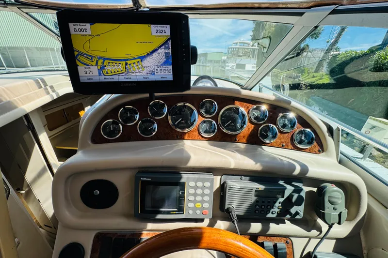 Slide: The Image of Cockpit of 2000 Sea Ray 290 Sundancer with navigation equipment and gauges. - 25