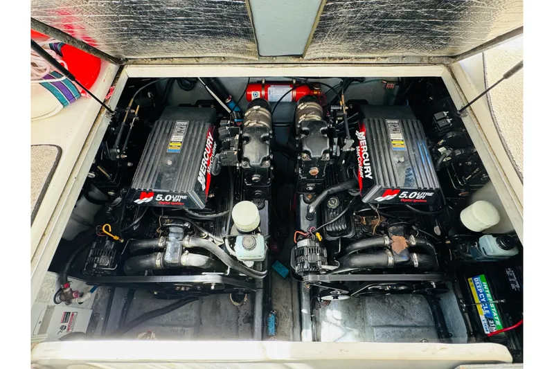 Slide: The Image of Engine compartment of a 2000 Sea Ray 290 Sundancer with twin Mercury 5.0L engines. - 41