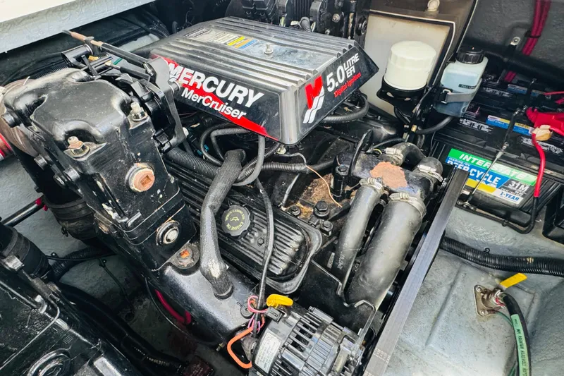 Slide: The Image of Engine compartment of a 2000 Sea Ray 290 Sundancer with Mercury MerCruiser 5.0L engine. - 42