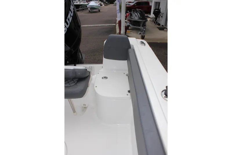 Slide: The Image of 2024 Clearwater 2300 CC boat interior with seating and Suzuki engine. - 13