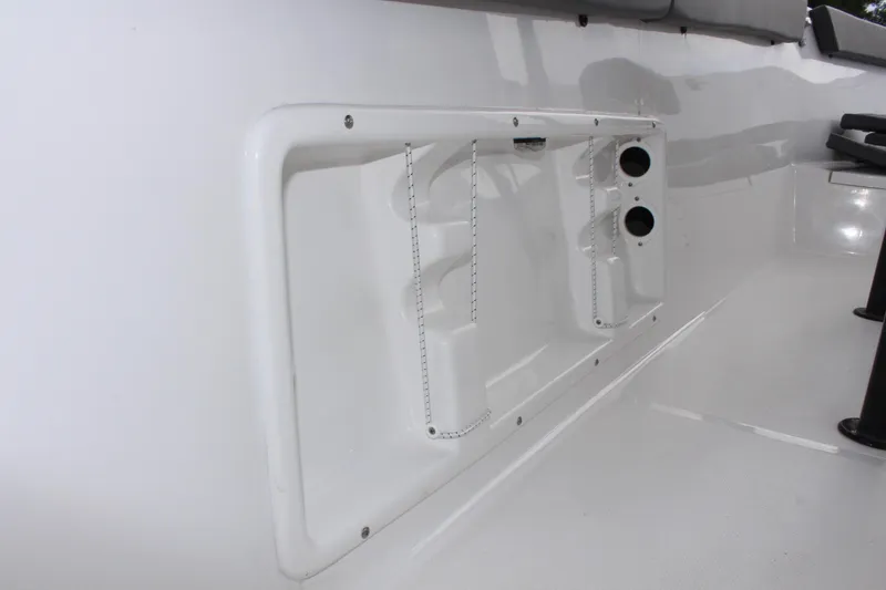 Slide: The Image of 2024 Clearwater 2300 CC boat interior detail, featuring sleek white design and functional components. - 30