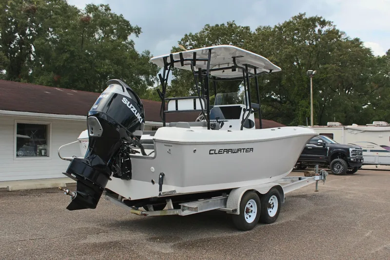 Slide: The Image of 2024 Clearwater 2300 CC boat on trailer with Suzuki outboard motor. - 6