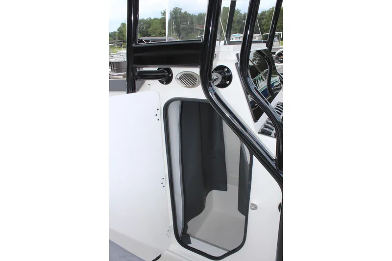 Slide: The Image of 2024 Clearwater 2300 CC boat interior with open storage compartment. - 25