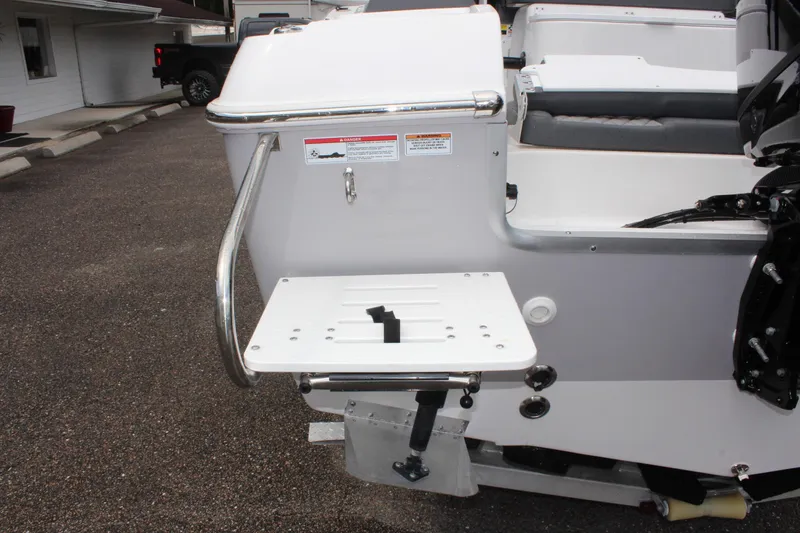 Slide: The Image of 2024 Clearwater 2300 CC boat with swim platform and stainless steel railing. - 9